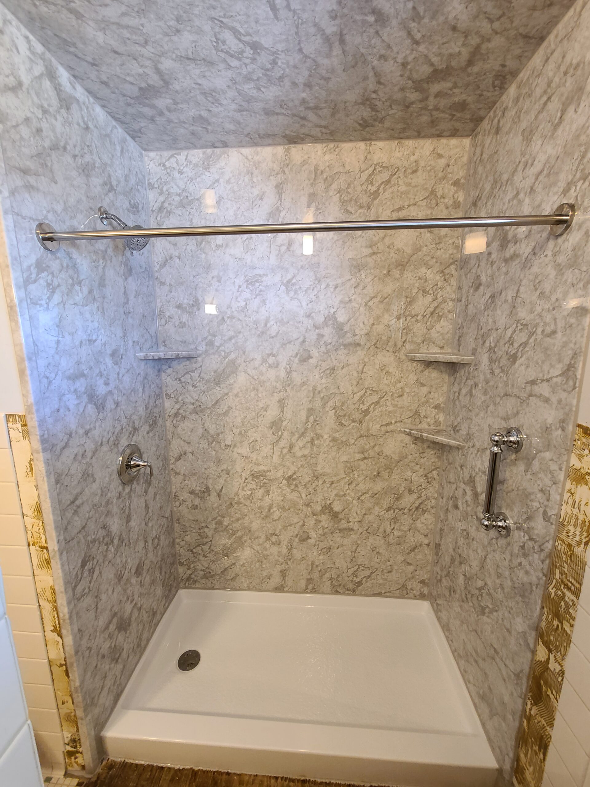 Bathroom remodel featuring modern shower walls