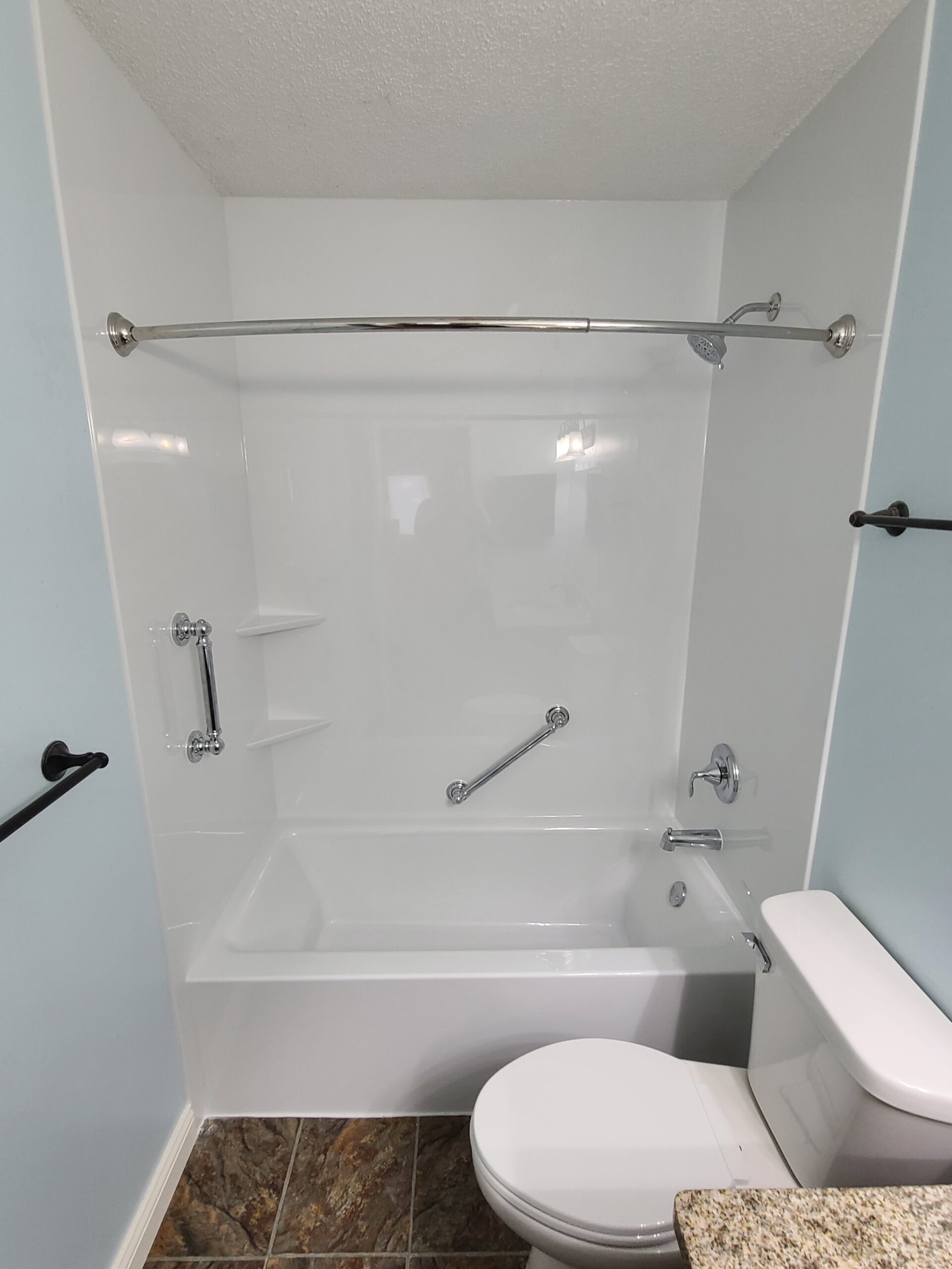 Finished bathroom remodel with clean tile and fixtures