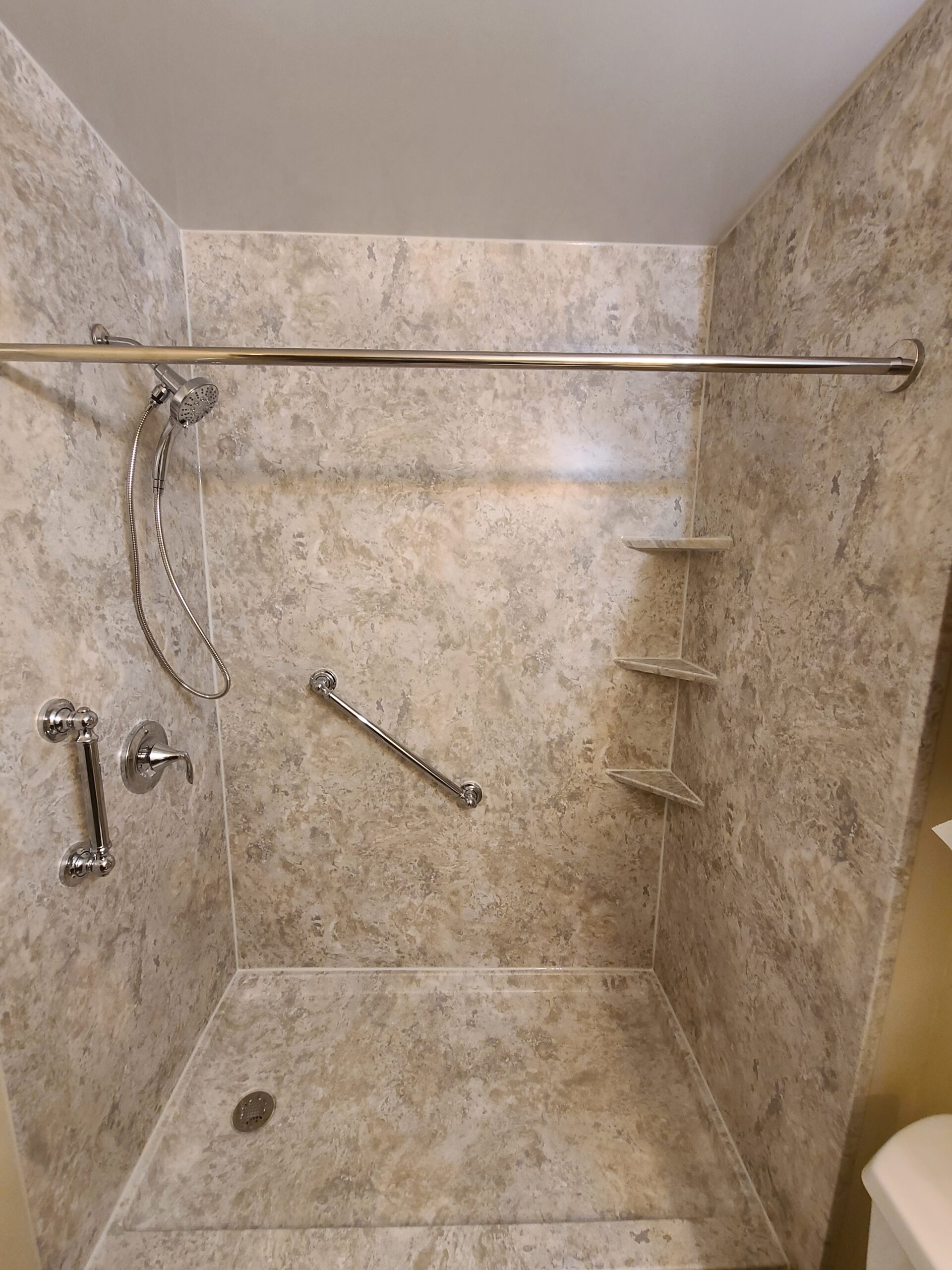Completed bathroom renovation with updated shower area