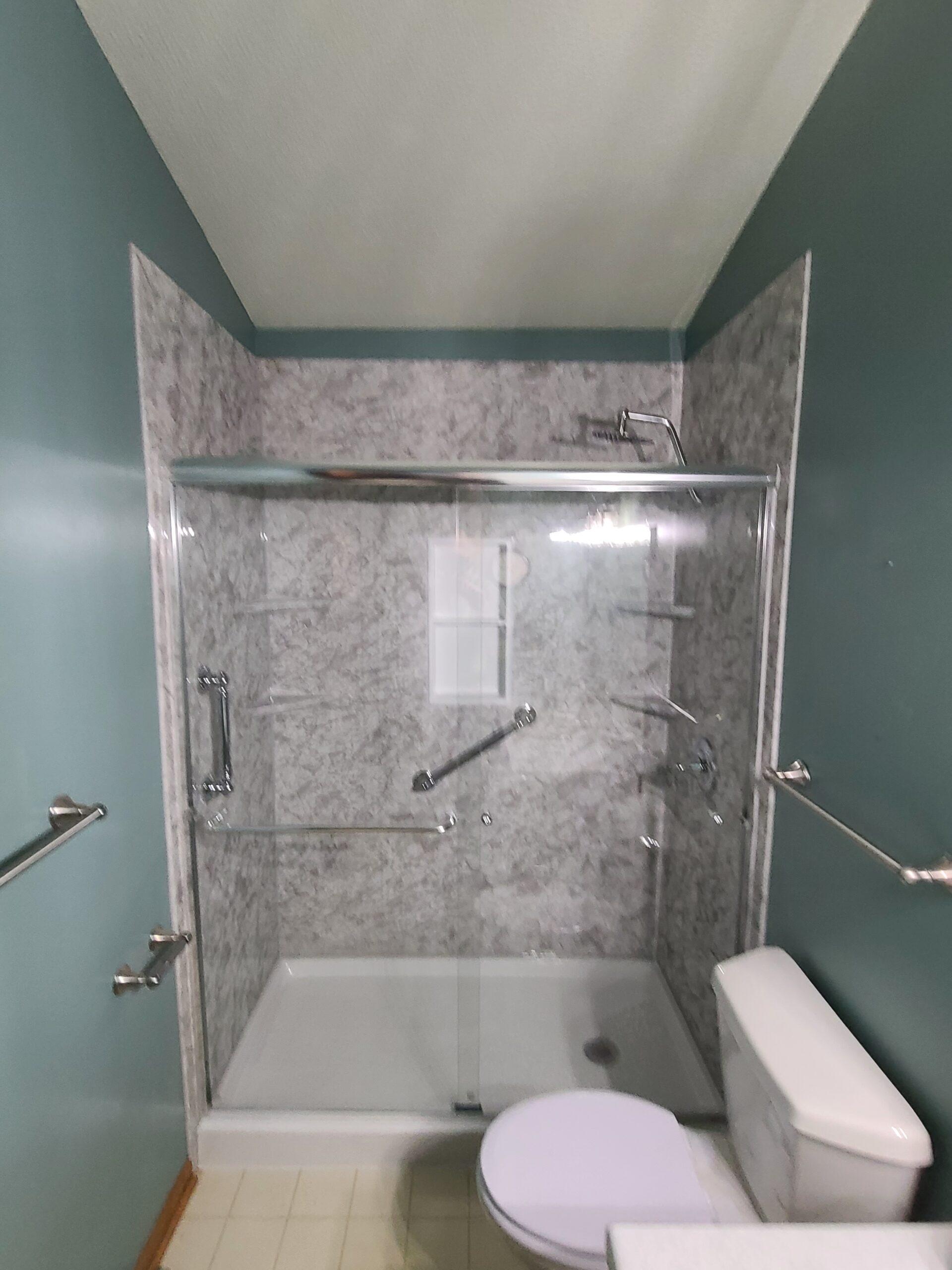 Residential bathroom remodel with new shower surround