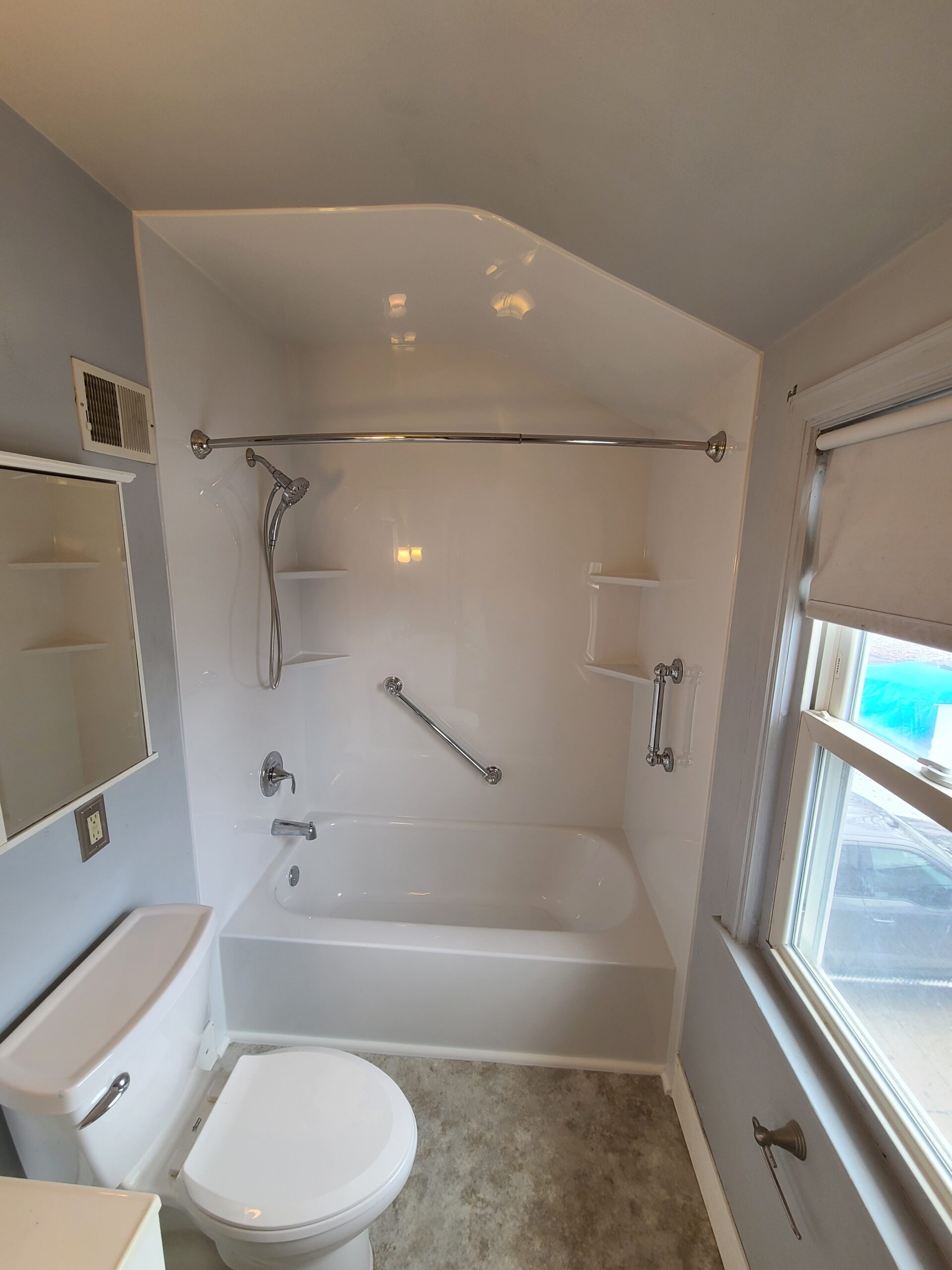 Finished bathroom remodel with refreshed layout