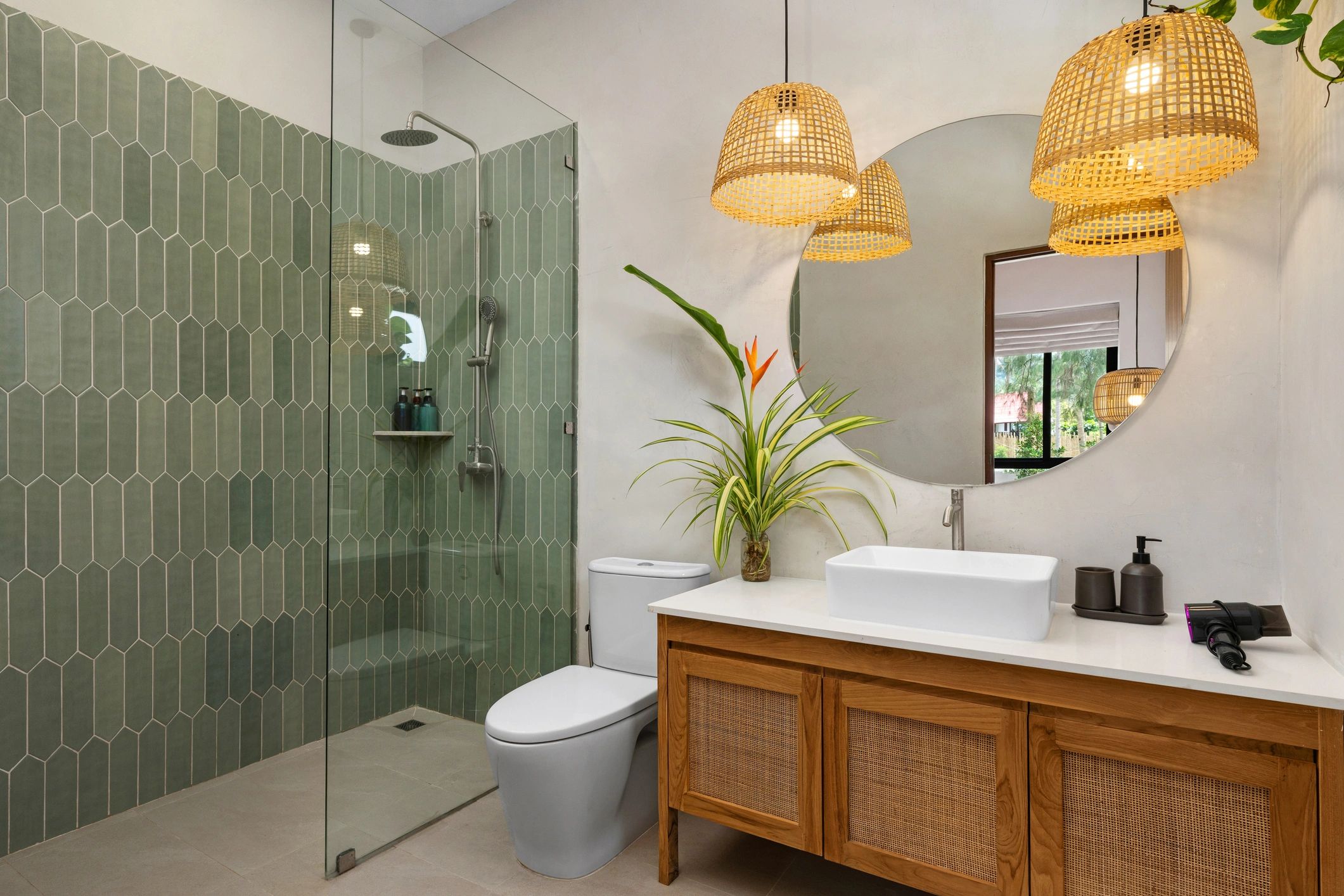 Modern walk-in shower with vanity in a remodeled bathroom