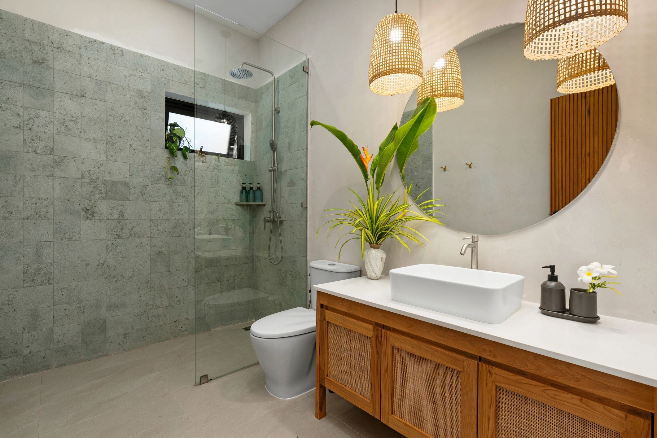 Modern walk-in shower and vanity in a remodeled bathroom