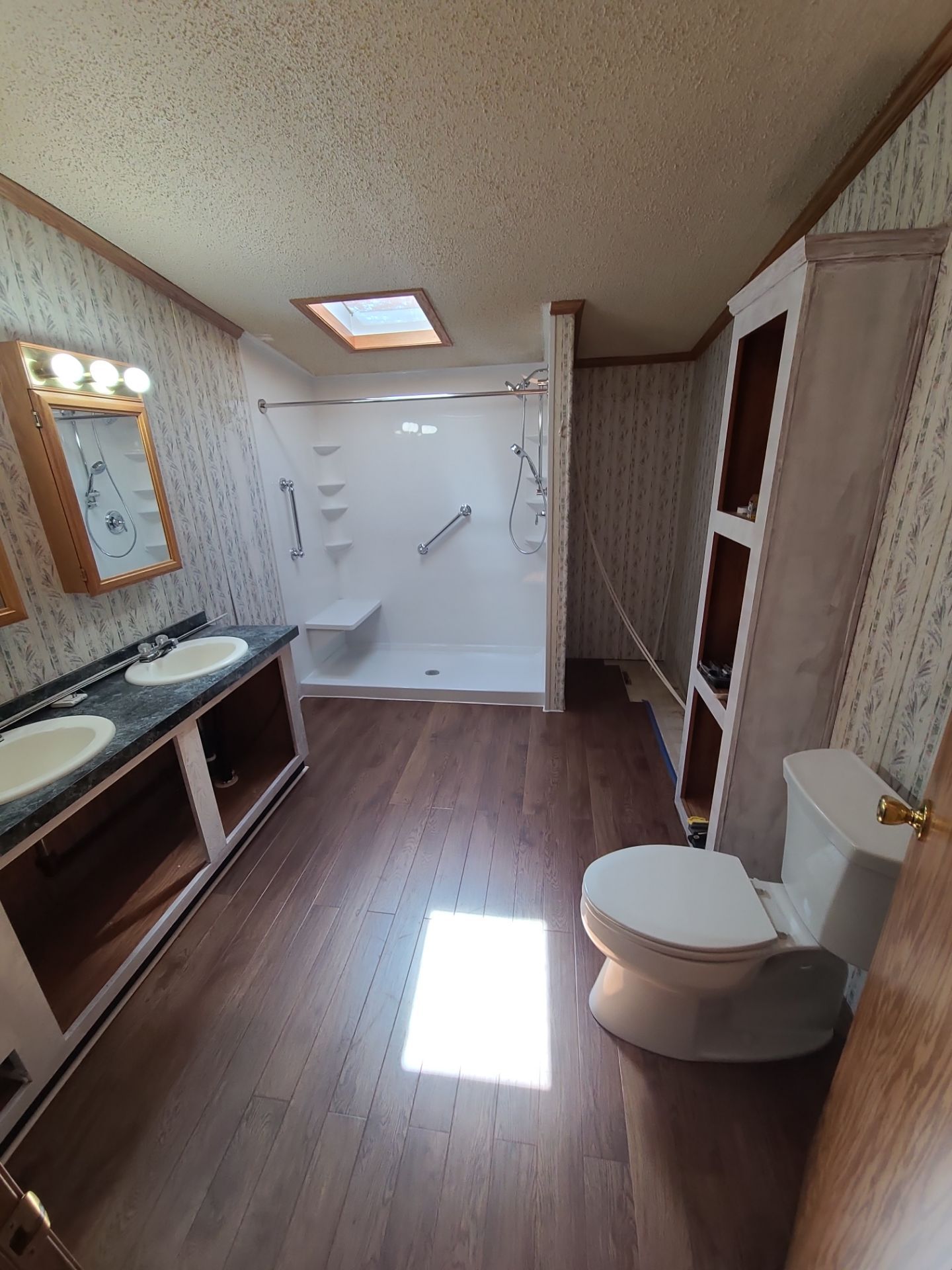 Bathroom project featuring a completed shower upgrade